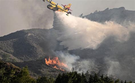 Plane fighting Greek island wildfire crashes killing both pilots, as Italian blaze claims 2 lives